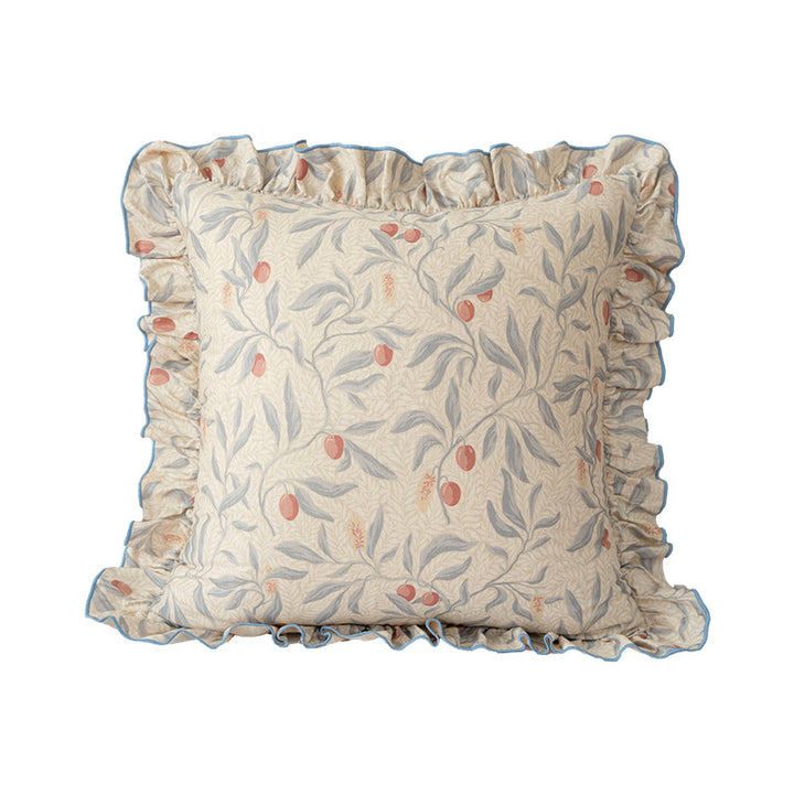 Decorative pillow with ruffles and floral linen cover