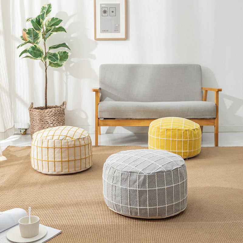 Round seat pouf with knitted check cover and shape-stable inner core
