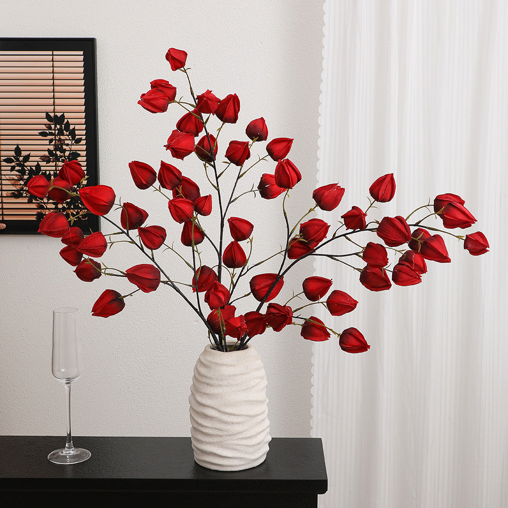 Artificial flower branch with vibrant flowers