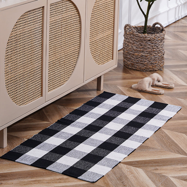 Flat-woven runner rug with check pattern and decorative border stripe