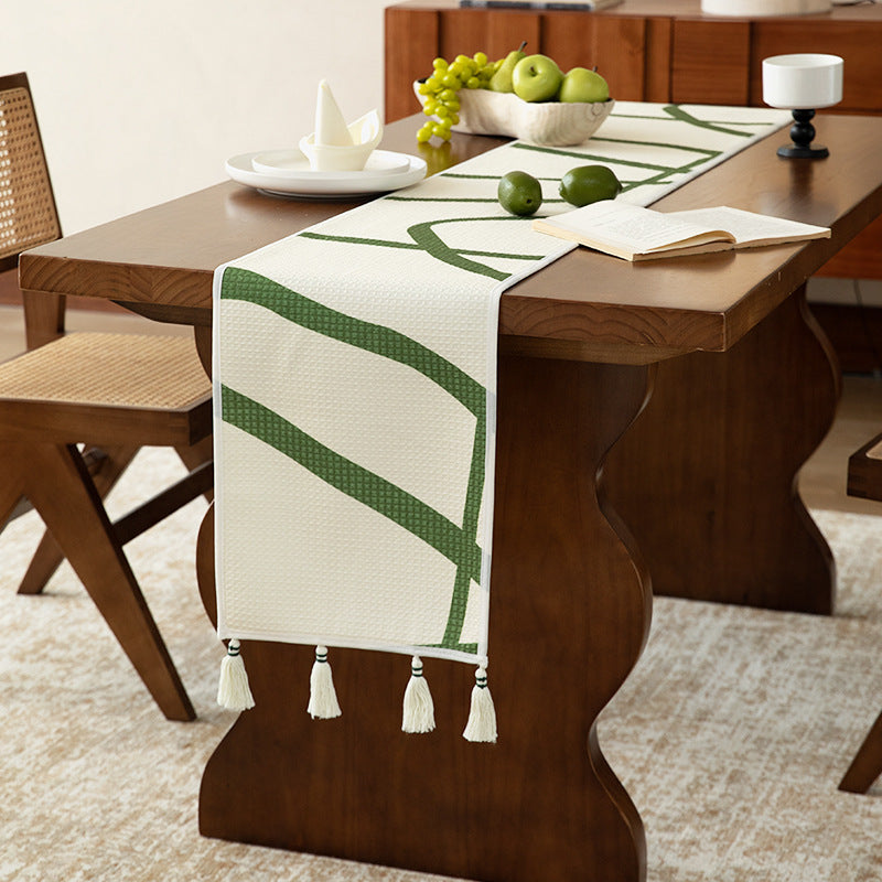 Light waffle texture throw blanket with geometric print and tassels