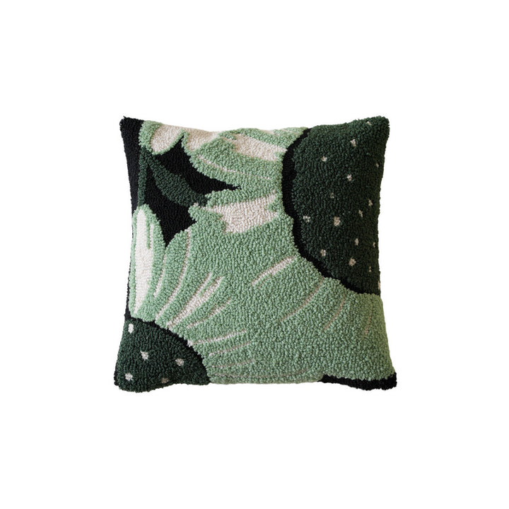 Hand-tufted decorative cushion with abstract graphic design and textured cotton surface