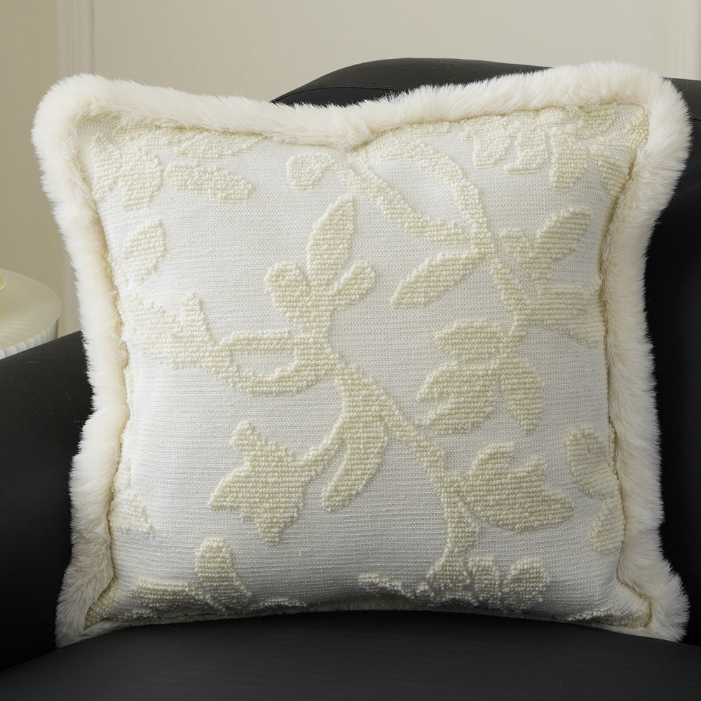 Square decorative pillow with embossed circular relief and soft faux fur edging