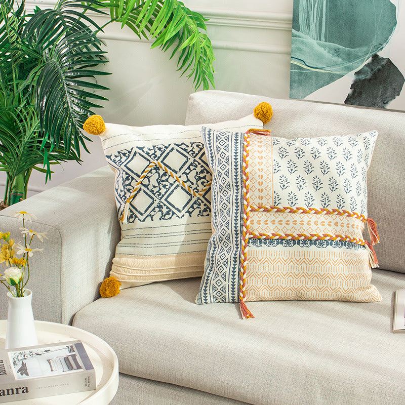 Woven decorative cushion cover in ethnic mix with braided ribbon and tassels