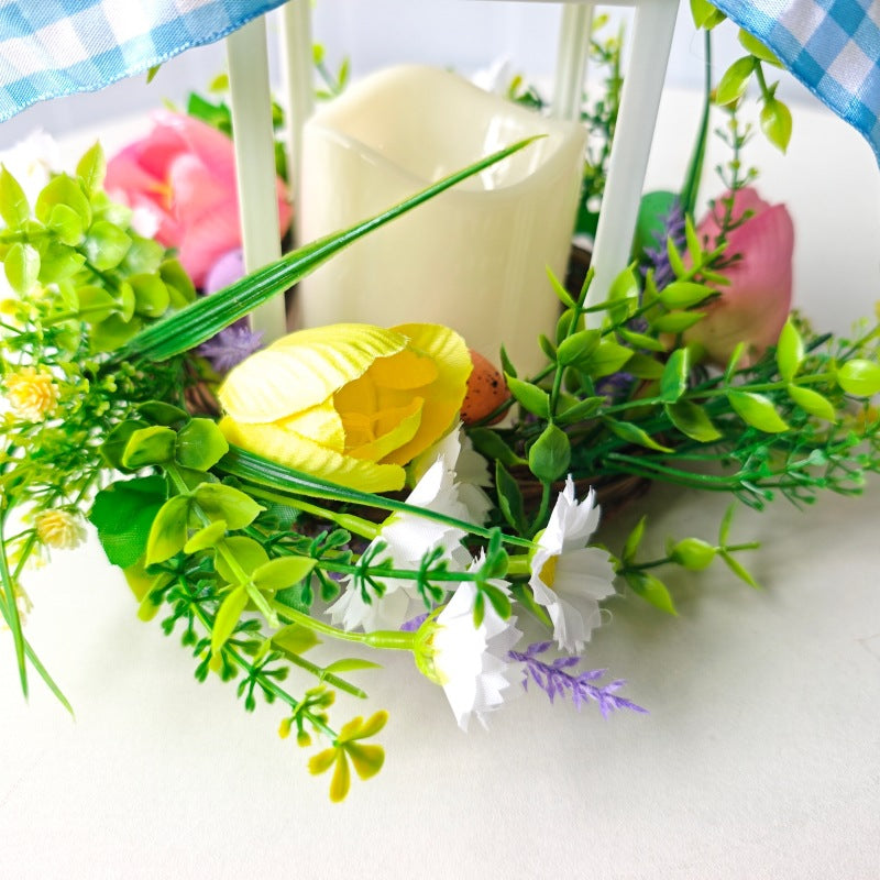 Decorative table lantern with artificial flowers and ribbon