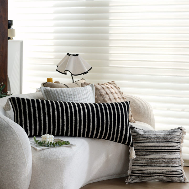 Woven home decor pillow cover with fine striped texture and hand-fringed edge