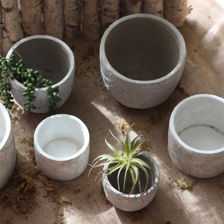 Decorative plant container made of handmade ceramic with leaf pattern