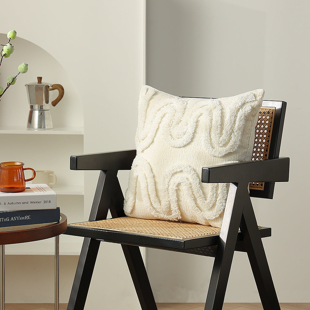 Geometric tufted sofa cushion with textured loop appliqué and removable cover