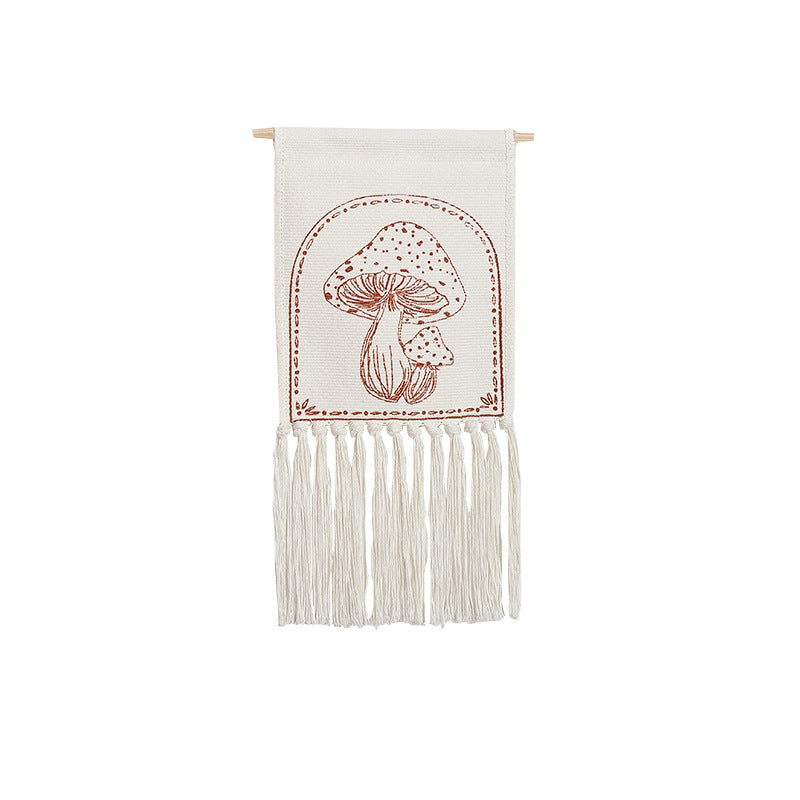 Woven wall hanging with hand-drawn mushroom motif and long cotton fringes