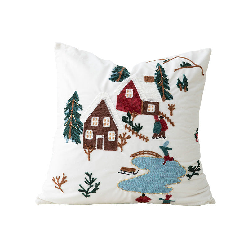 Festive embroidered decorative pillow with reindeer motif and removable cover