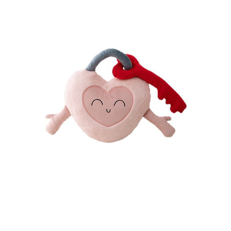 Heart-shaped cuddle castle cushion with attached key and friendly face