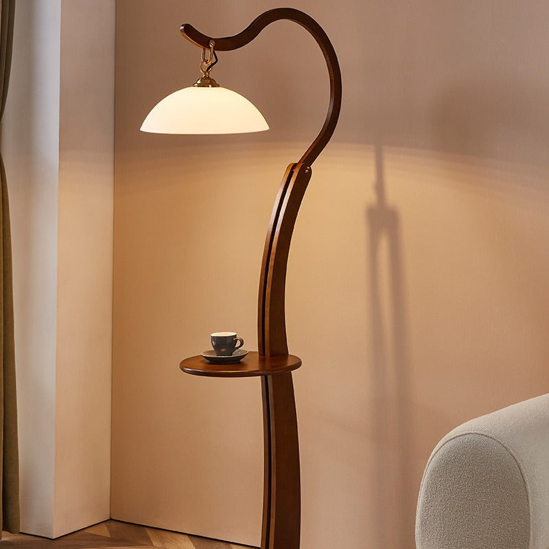Artistic floor lamp with integrated side table