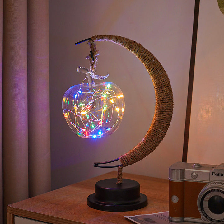 Decorative glass apple LED table lamp with moon-shaped rope-wrapped stand
