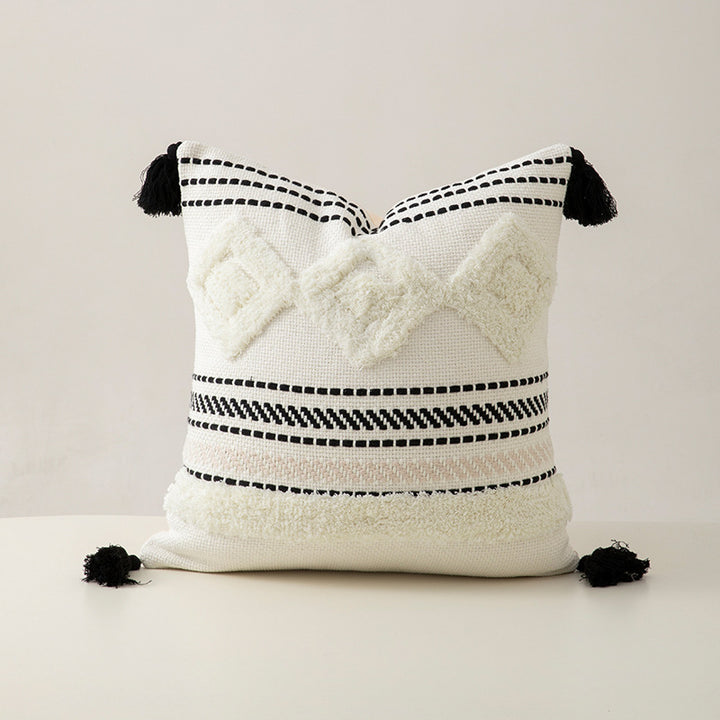 Handwoven decorative cushion cover made of cotton blend with tassels and structured stripe look