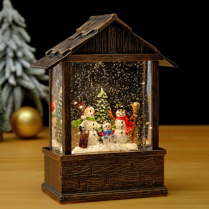 Nostalgic snow globe decoration with Santa Claus and children