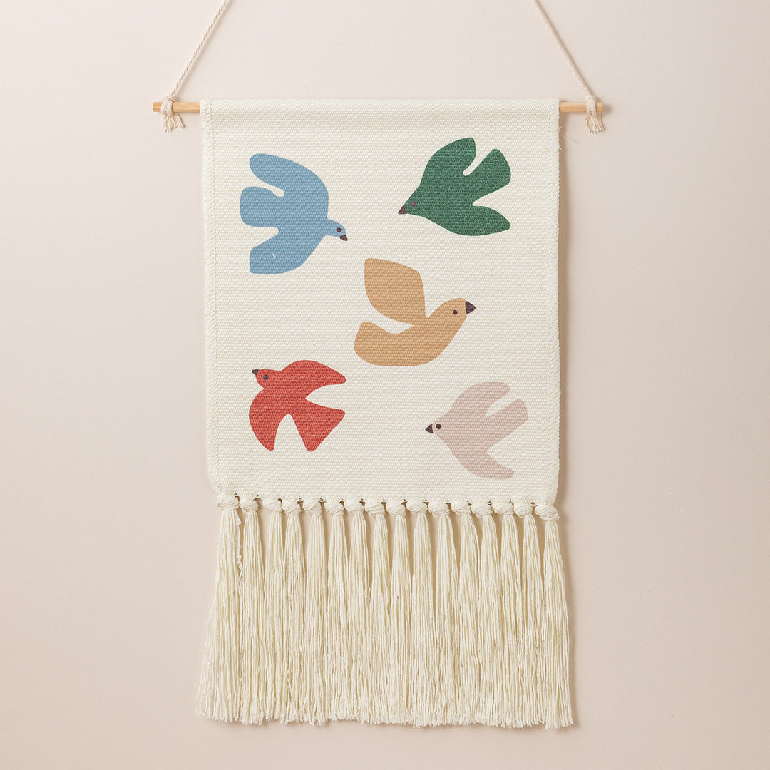 Woven wall hanging with hand-knotted fringes and bunny motif