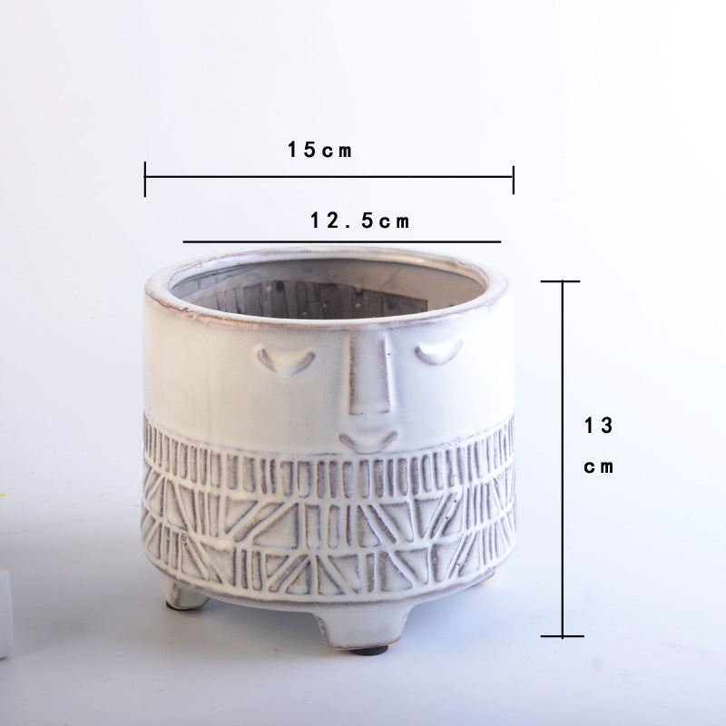 Decorative plant pot with facial features