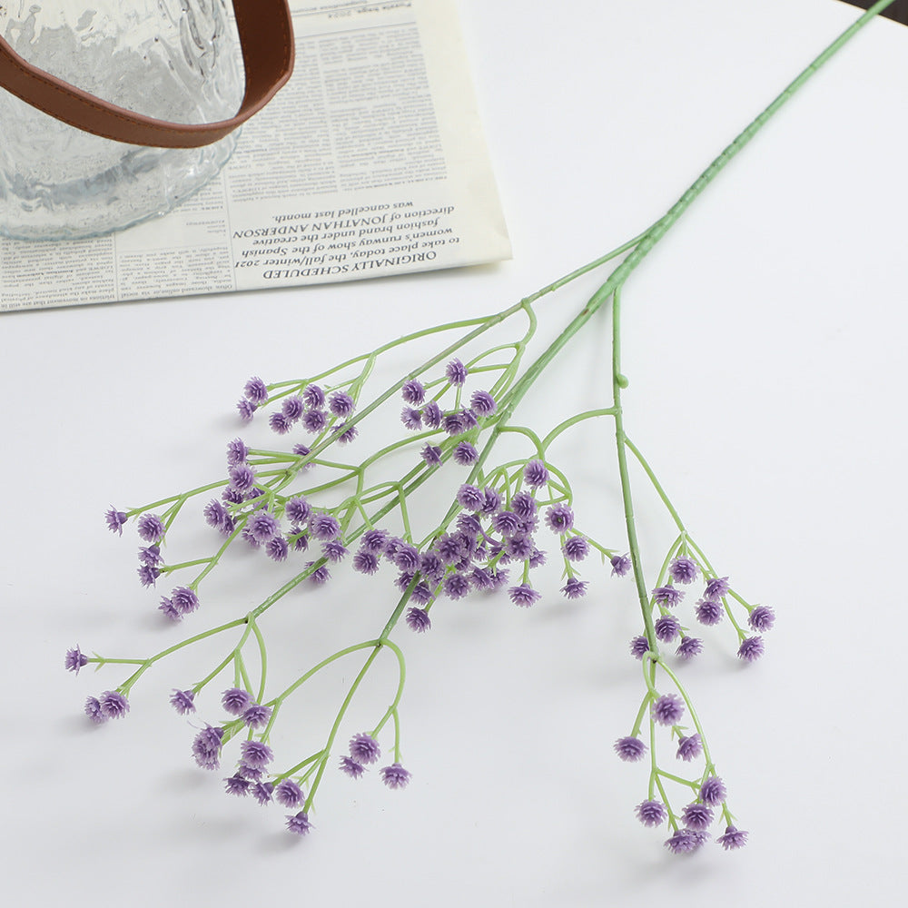 Decorative artificial flower branch with fine purple flowers