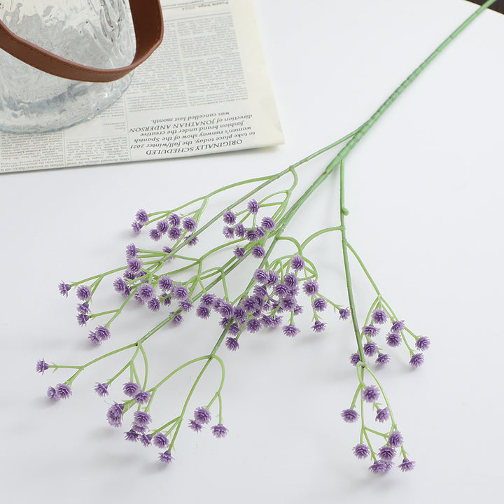 Decorative artificial flower branch with fine purple flowers