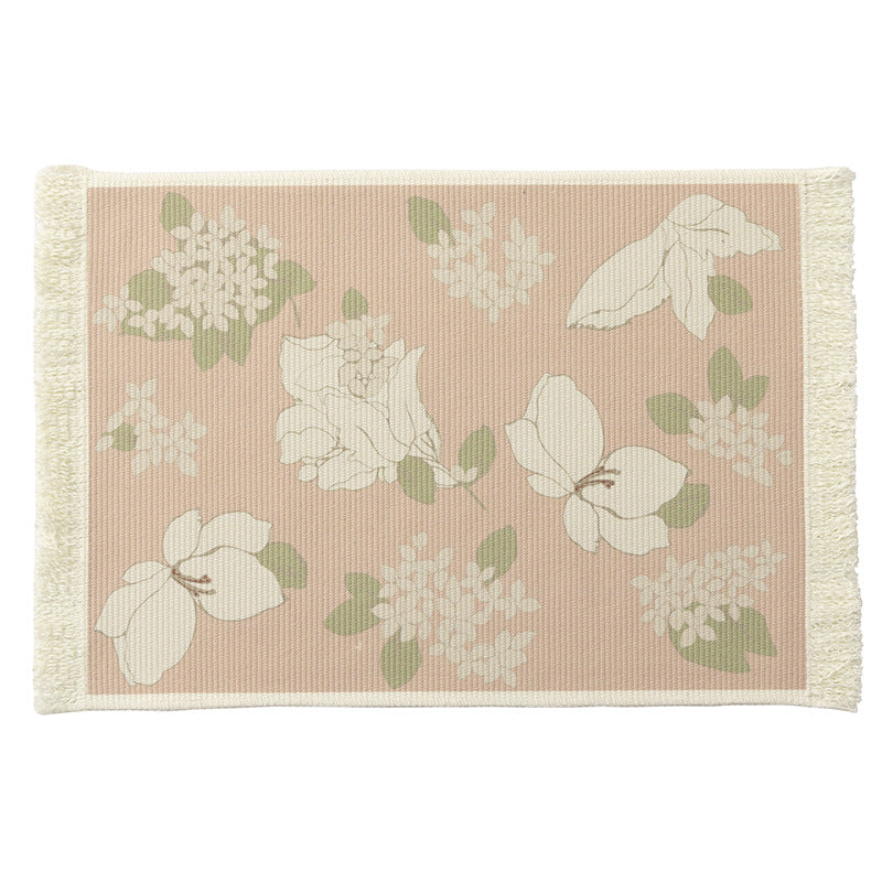 Floral woven bath mat with decorative fringes
