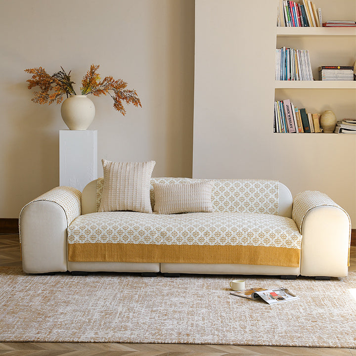 Sofa cover and sofa runner made of knitted cotton blend with non-slip edge