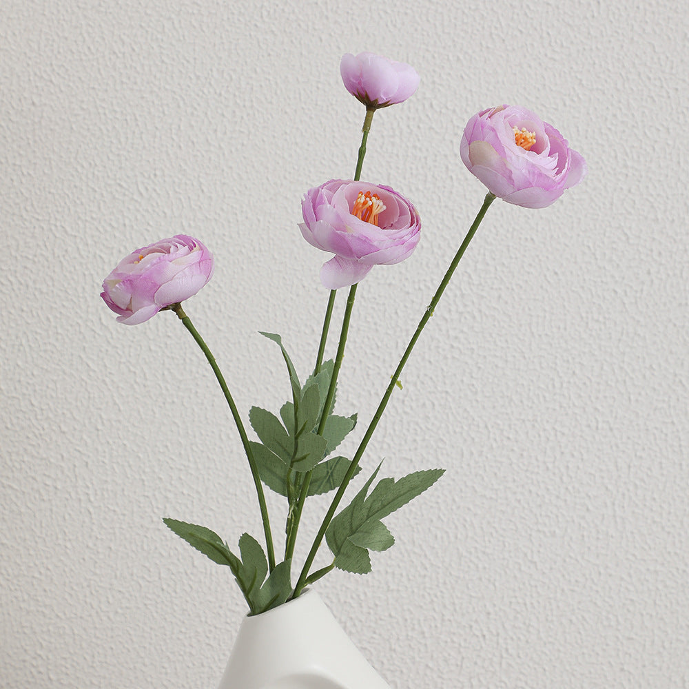 Decorative artificial flower bouquet with intricately detailed ranunculus