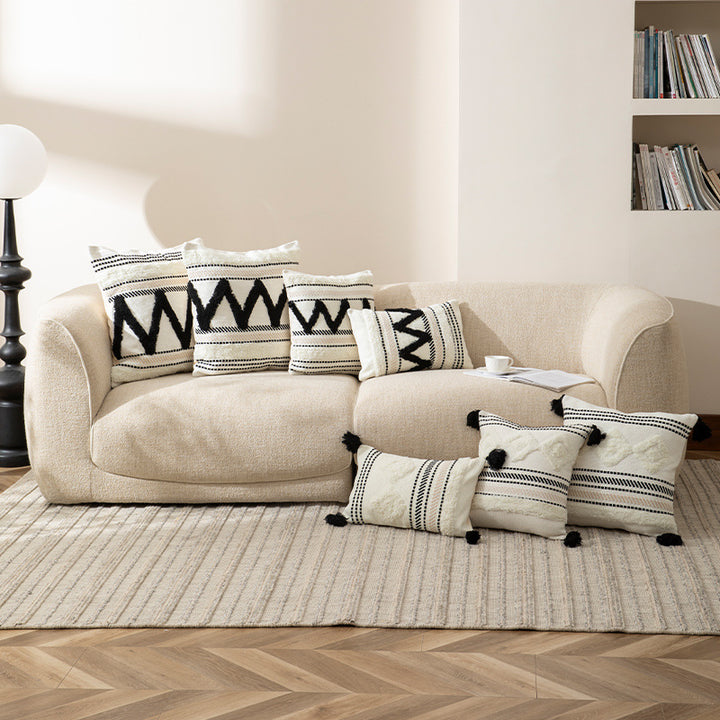 Handwoven decorative cushion cover made of cotton blend with tassels and structured stripe look