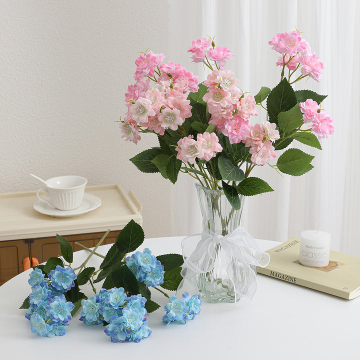 Artificial flower arrangement with delicate white blooms