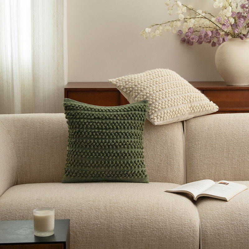 Structured knitted cushion with bobble look