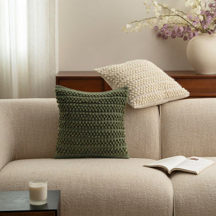 Structured knitted cushion with bobble look