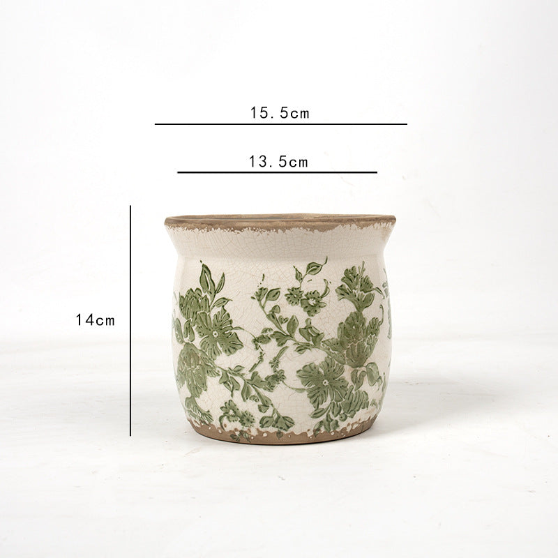 Decorative ceramic plant container with artistic design