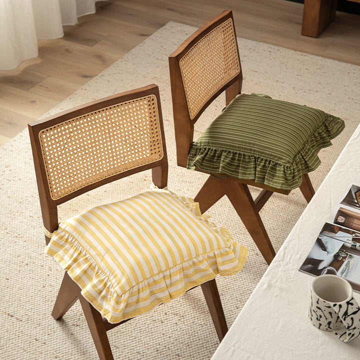 Striped chair cushion with ties, ruffled hem and linen look