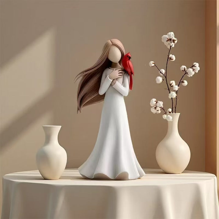 Figurine Holding Bird