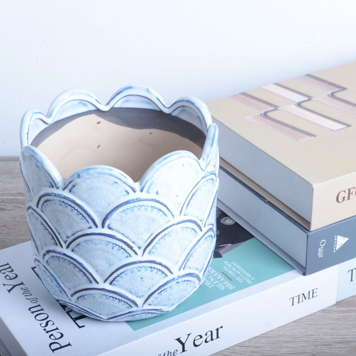 Decorative ceramic pot with sculptural design