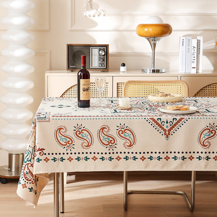 Water-repellent rectangular tablecloth with paisley pattern and coated cotton look