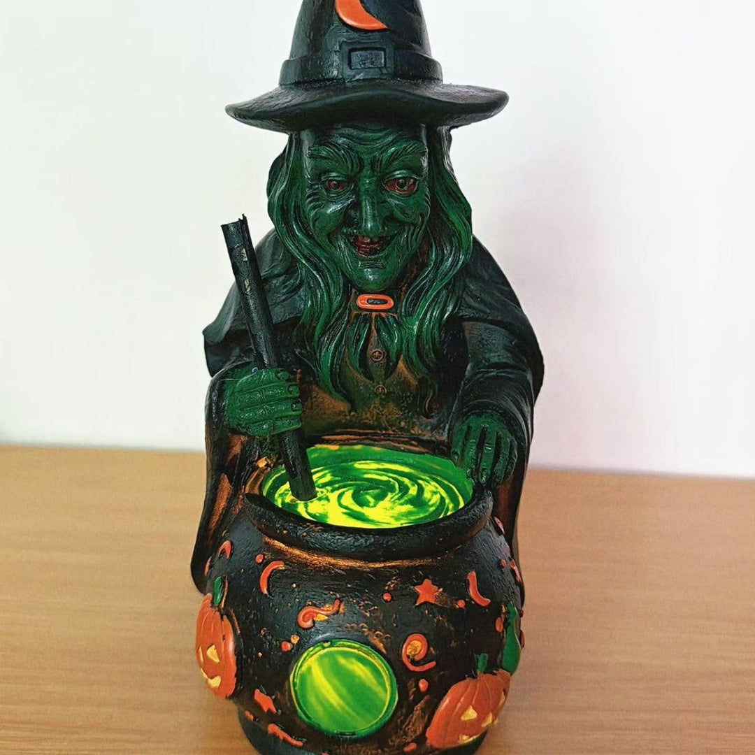 Decorative witch figure with cauldron
