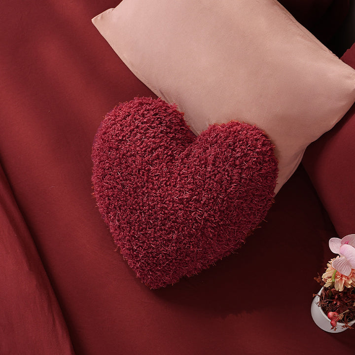 Heart-shaped plush cuddle pillow