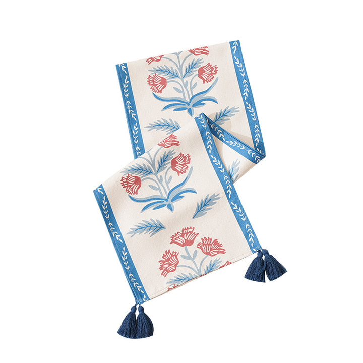Table runner made of linen blend with floral block print motifs and tassels