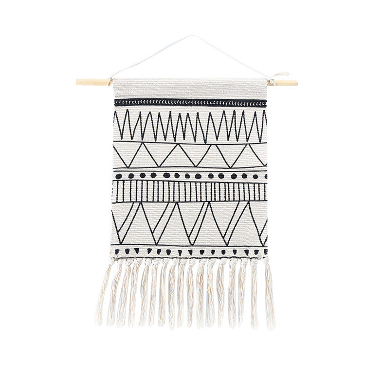 Woven Boho wall hanging with fringes and graphic ethnic pattern