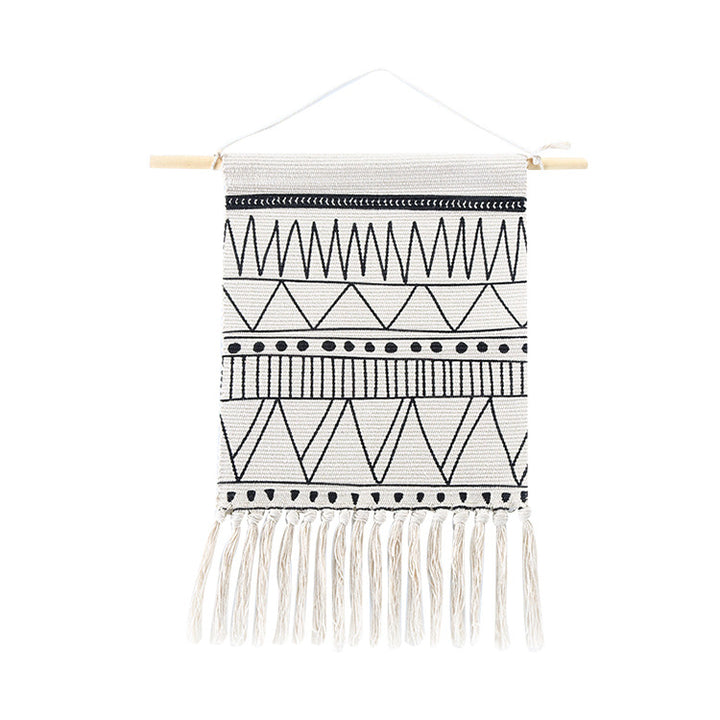 Woven Boho wall hanging with fringes and graphic ethnic pattern