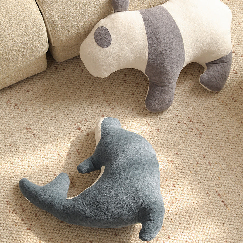 Playful dolphin cuddle pillow with ergonomic neck and arm recess