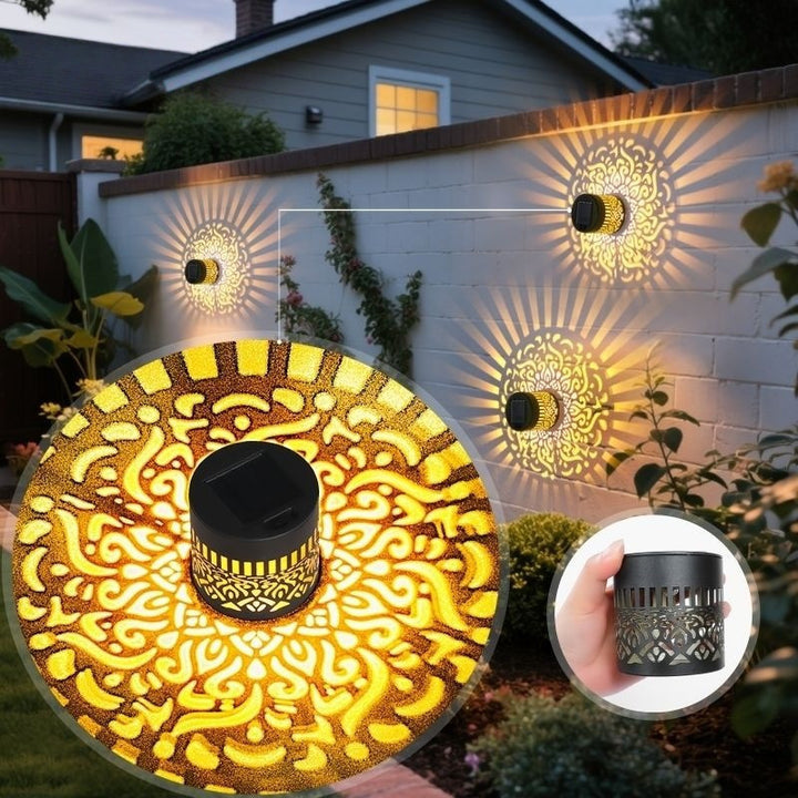 Decorative filigree metal tealight lantern with reflective inner lining