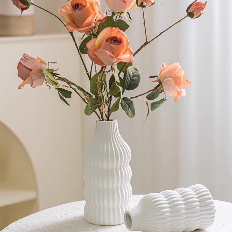 Stylish ceramic vase with wave structure