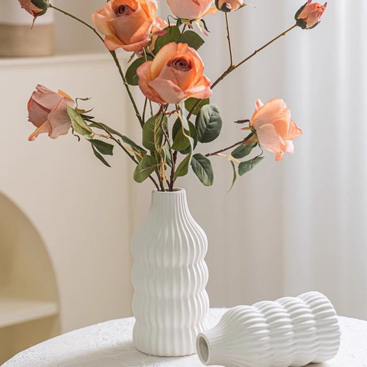 Stylish ceramic vase with wave structure