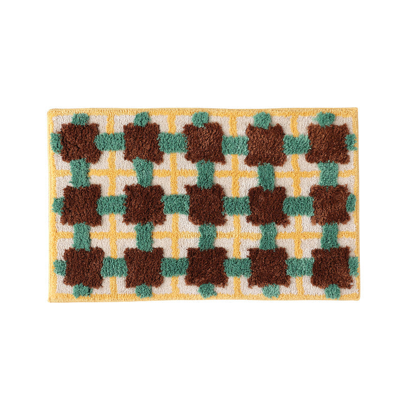 Hand-tufted bathroom bath mat with non-slip backing and textured square relief