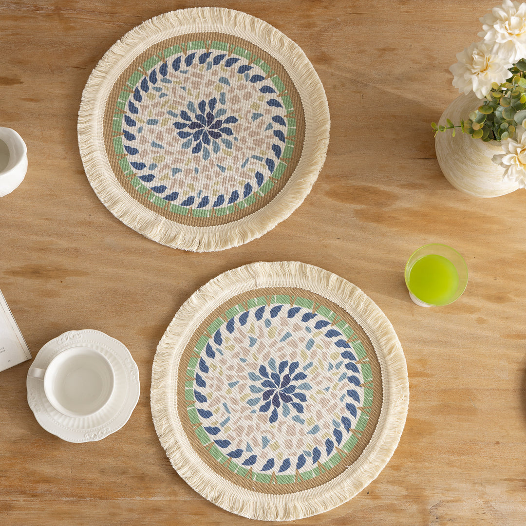 Round handmade woven decorative rug with fringes and botanical pattern