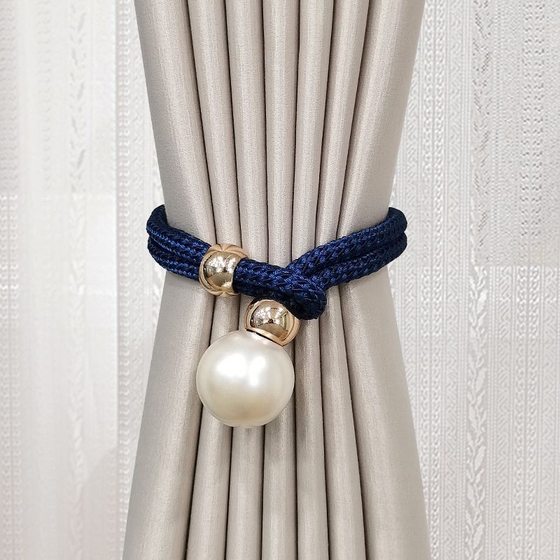 Elegant curtain tieback with decorative pearl