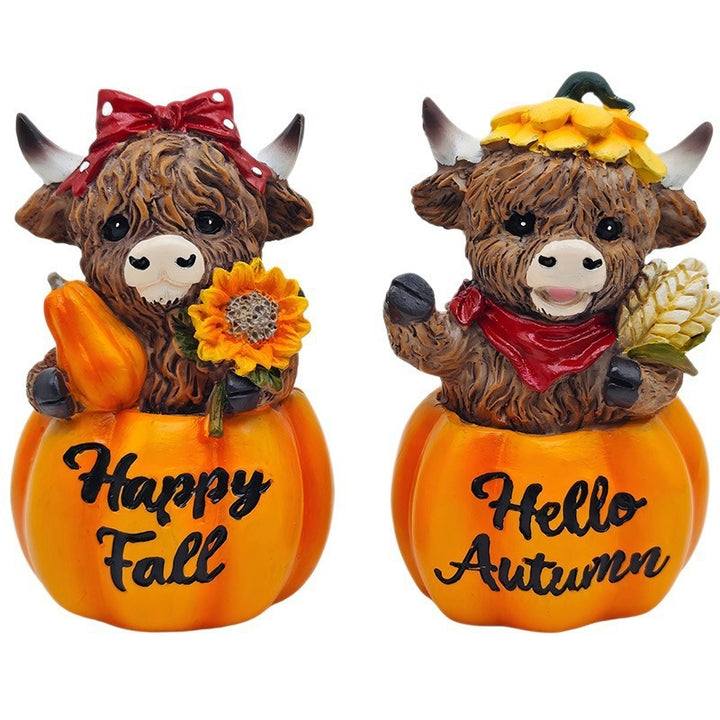 Funny decorative figure of a Highland cow in pumpkin costume