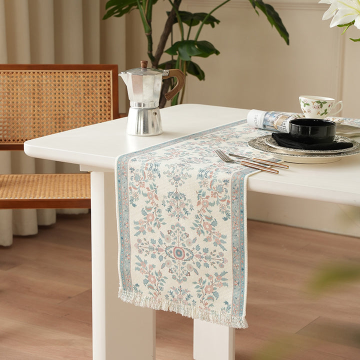 Woven jacquard table runner with floral medallion and fringes