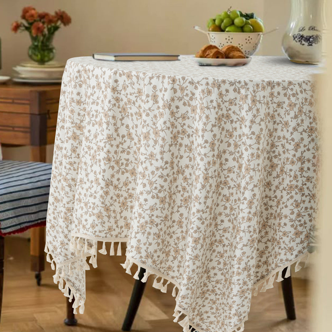 Rectangular tablecloth made of cotton-linen blend with delicate floral print and tassels